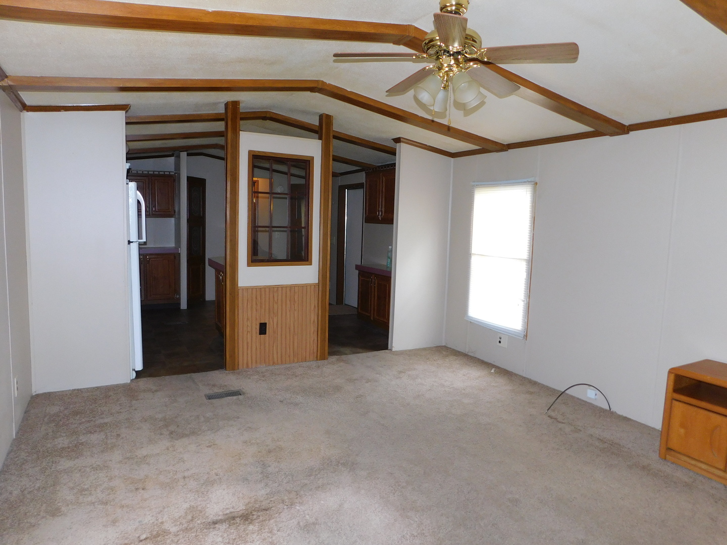 69 Apple Lane Bourbonnais, IL 60914 - Photo 2 of 11 a view of a livingroom with a ceiling fan and window