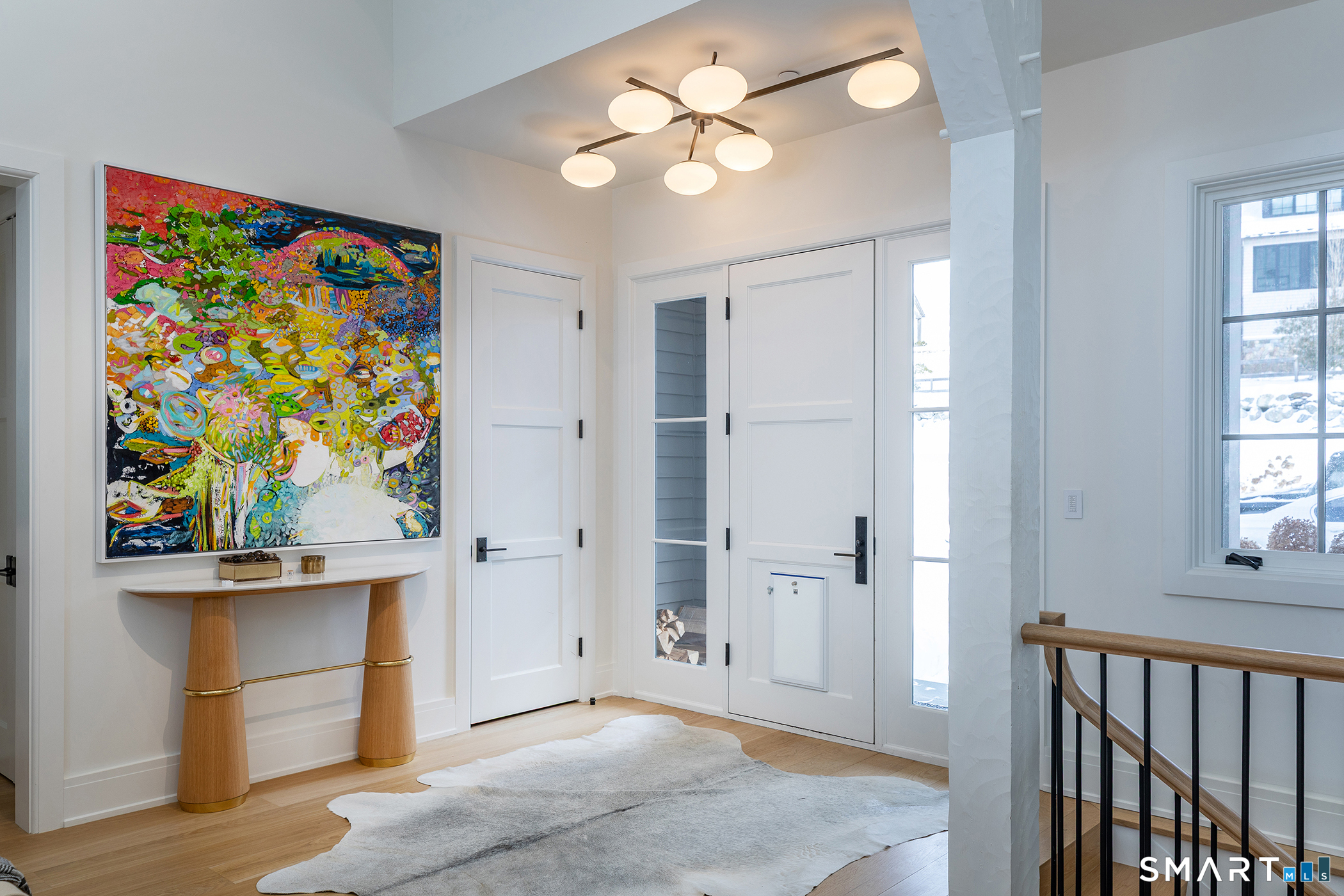 292 Wood Duck Road Amenia, NY 12501 - Photo 9 of 30 wooden floor with chandelier fan and refrigerator in a room
