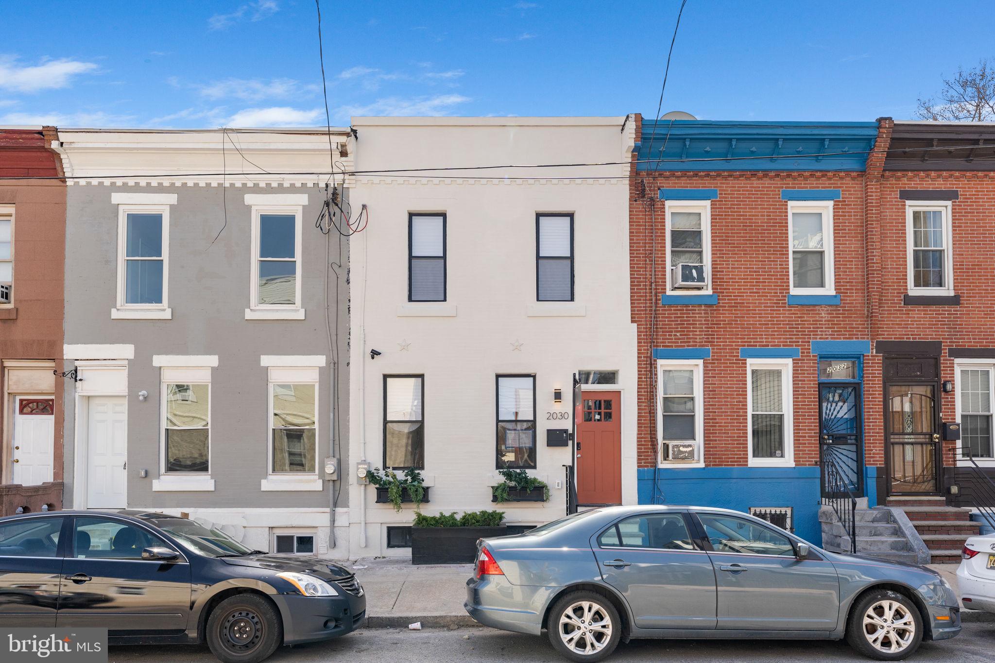 2030 Tasker Street Philadelphia, PA 19145 - Photo 3 of 29 a front view of a house with parking space