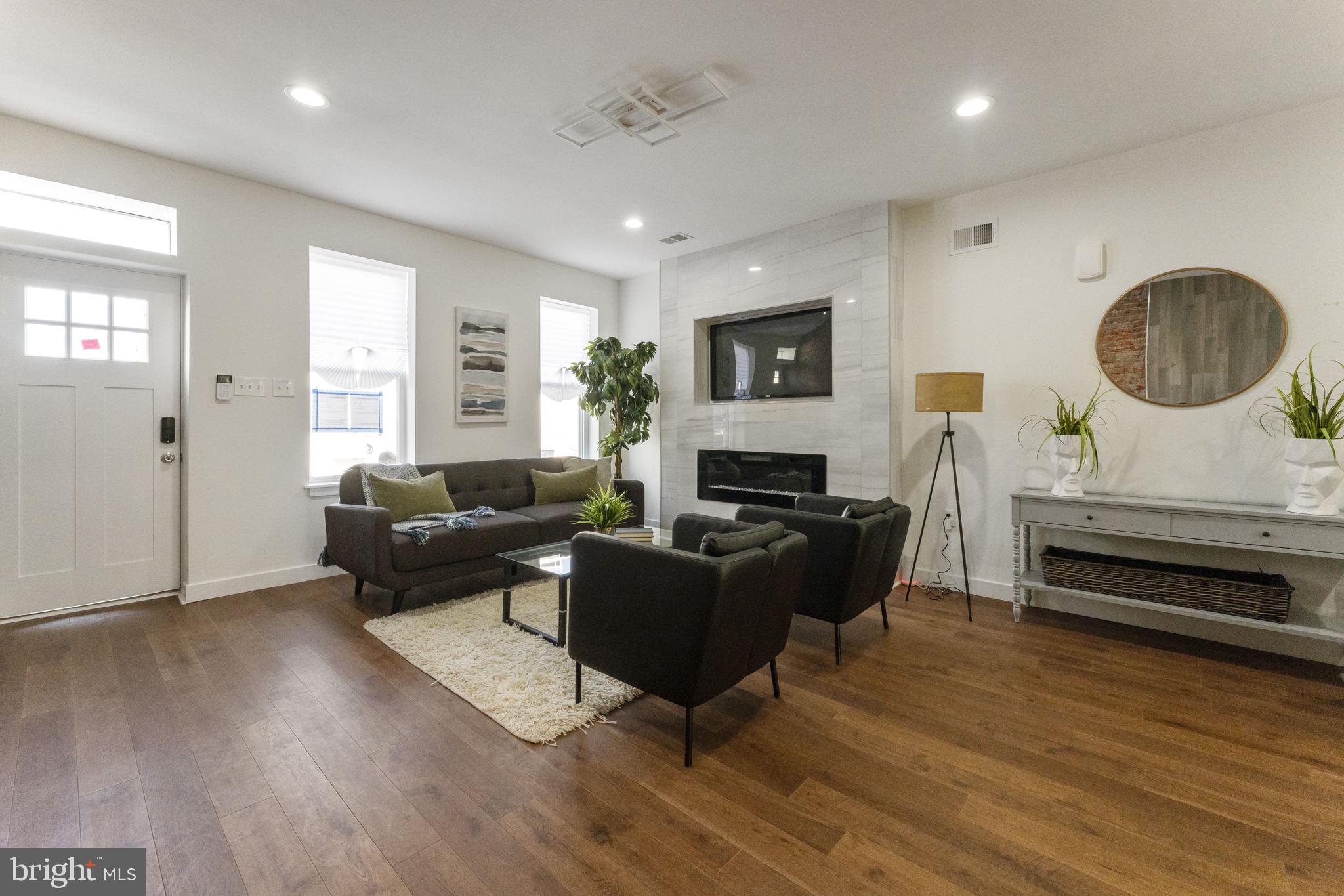 2030 Tasker Street Philadelphia, PA 19145 - Photo 6 of 29 a living room with furniture and a wooden floor