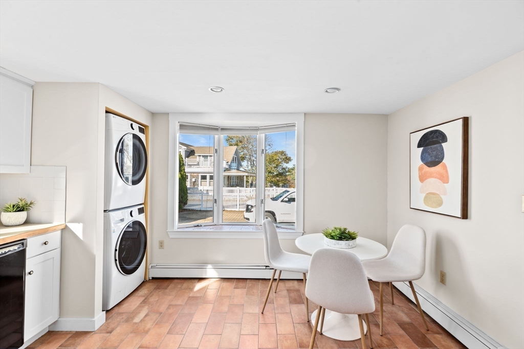 50 Collier Road Scituate, MA 02066 - Photo 13 of 41 a living room with furniture a flat screen tv and a fireplace