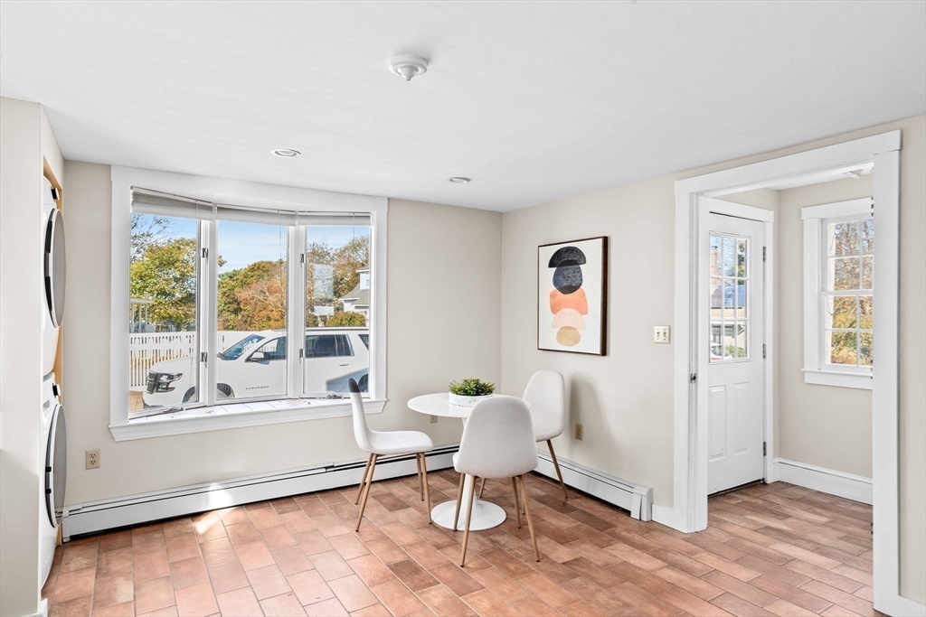 50 Collier Road Scituate, MA 02066 - Photo 14 of 41 a living room with furniture and a large window