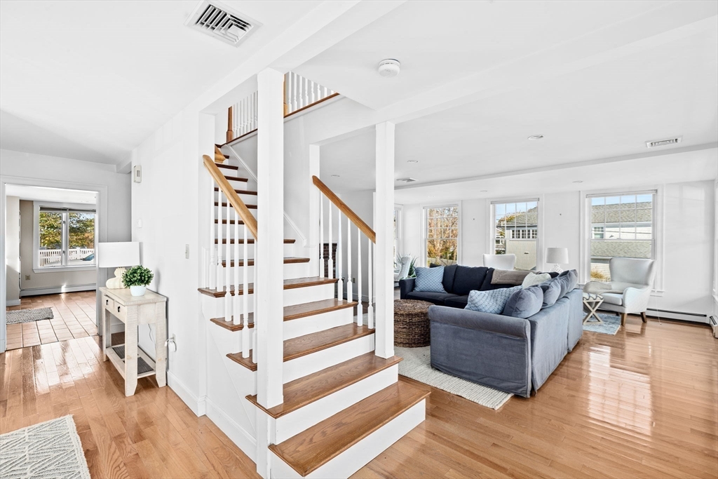 50 Collier Road Scituate, MA 02066 - Photo 21 of 41 a living room with furniture and wooden floor