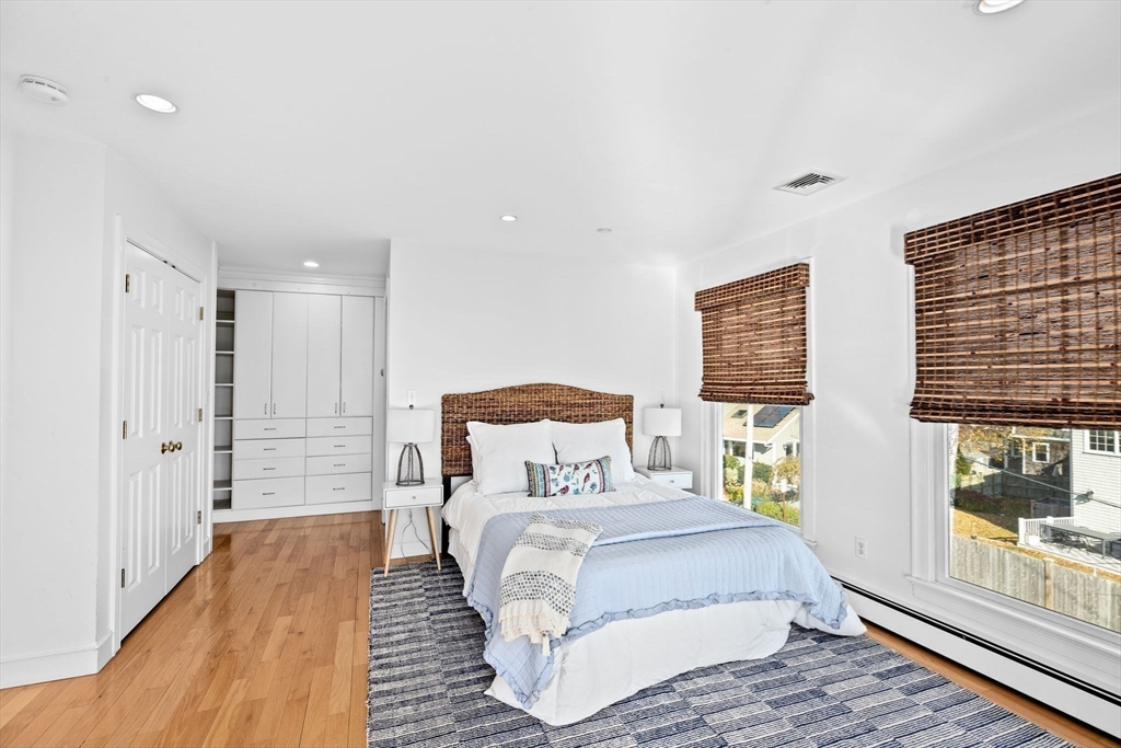 50 Collier Road Scituate, MA 02066 - Photo 23 of 41 a bedroom with a bed and wooden floor