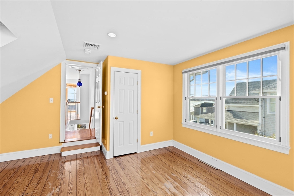 50 Collier Road Scituate, MA 02066 - Photo 27 of 41 a view of a room with wooden floor and windows