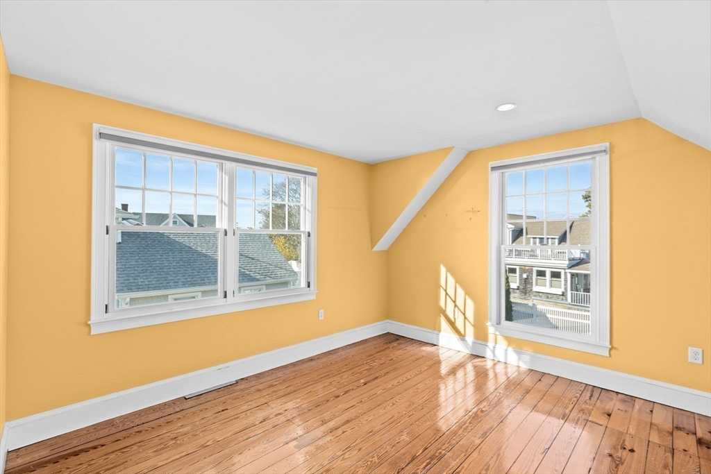 50 Collier Road Scituate, MA 02066 - Photo 29 of 41 a view of an empty room with wooden floor and a window