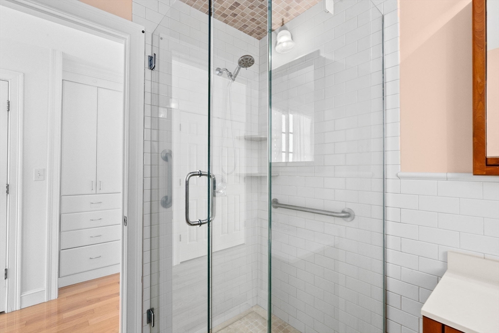 50 Collier Road Scituate, MA 02066 - Photo 30 of 41 a bathroom with a glass shower door