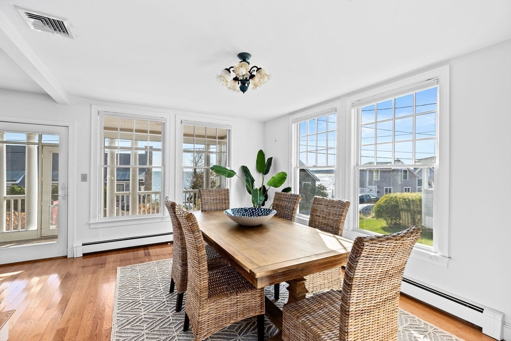 50 Collier Road Scituate, MA 02066 - Photo 3 of 41 a view of a dining room with furniture window and wooden floor