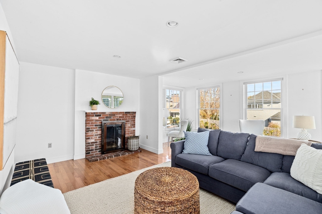 50 Collier Road Scituate, MA 02066 - Photo 6 of 41 a living room with furniture a fireplace and a window