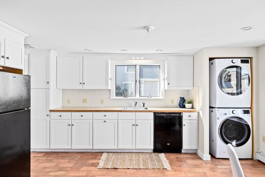 50 Collier Road Scituate, MA 02066 - Photo 10 of 41 a view of a kitchen with a sink dryer and cabinets