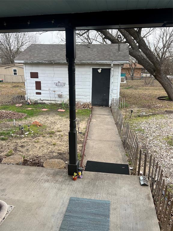 704 East 9th Street Kemp, TX 75143 - Photo 6 of 13 a view of a entrance gate of the house