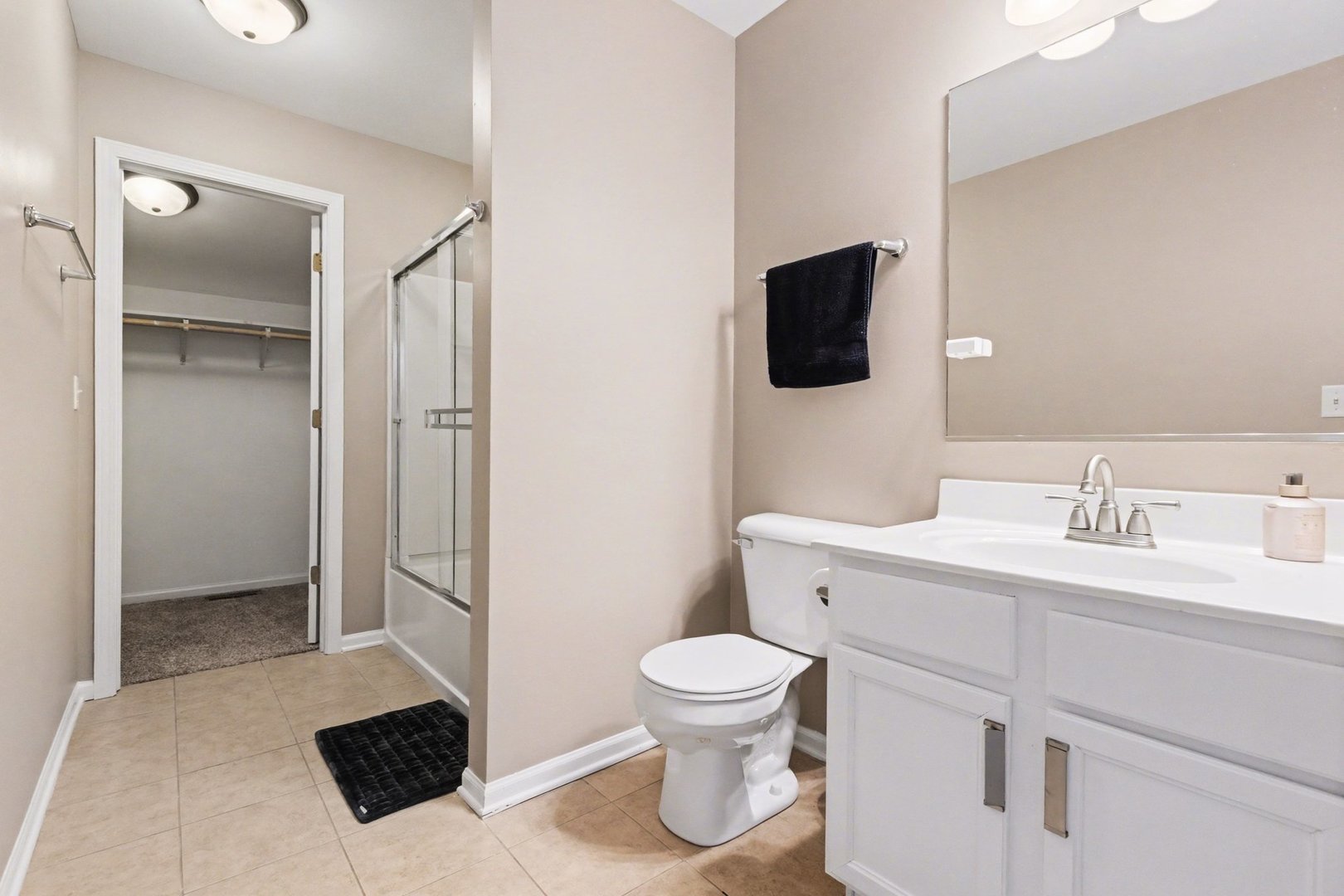 906 Bluebell Circle Joliet, IL 60431 - Photo 12 of 18 a bathroom with a toilet sink and mirror