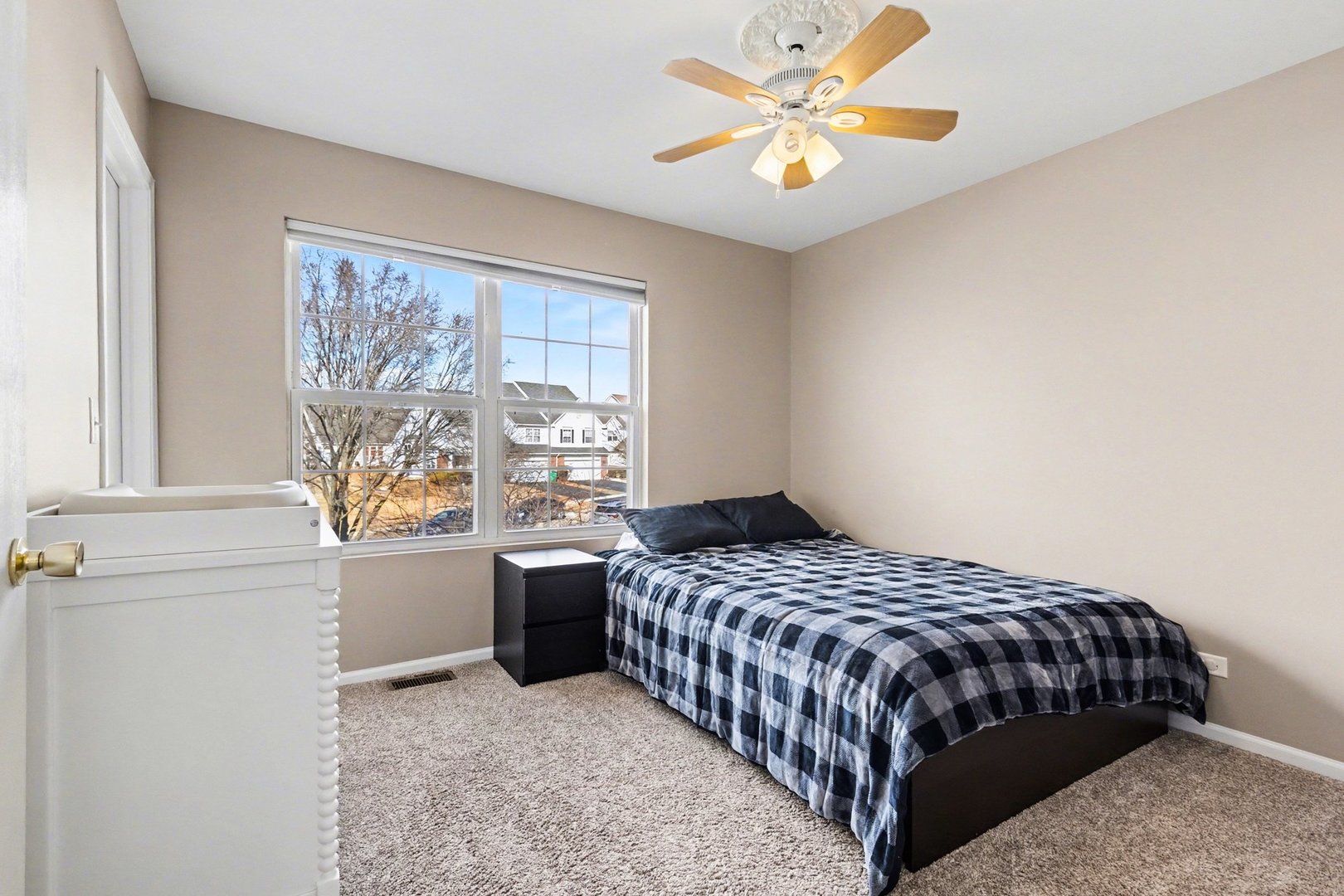 906 Bluebell Circle Joliet, IL 60431 - Photo 13 of 18 a bedroom with a bed and a window