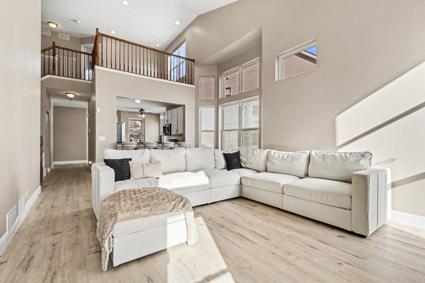 906 Bluebell Circle Joliet, IL 60431 - Photo 4 of 18 a living room with furniture and a wooden floor