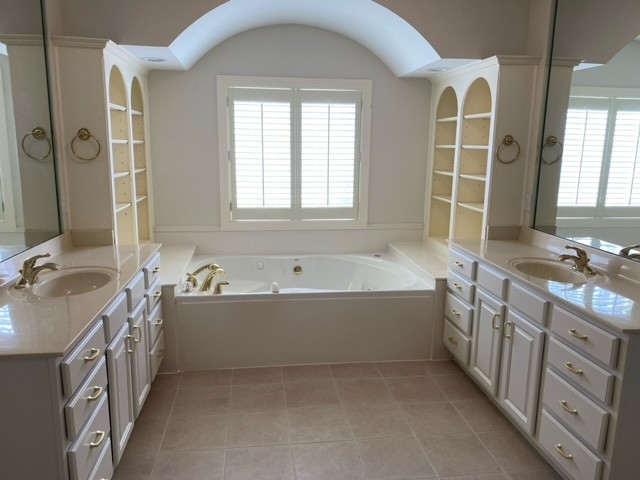 104 Gardengate Drive Franklin, TN 37069 - Photo 2 of 9 a spacious bathroom with sinks mirror and a bathtub