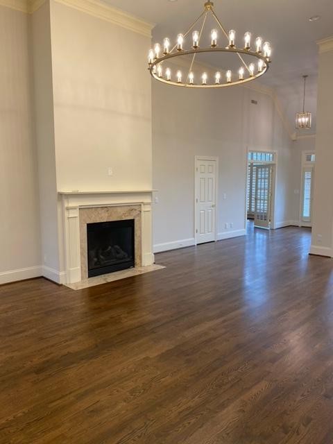 104 Gardengate Drive Franklin, TN 37069 - Photo 3 of 9 a view of an empty room with wooden floor and a fireplace