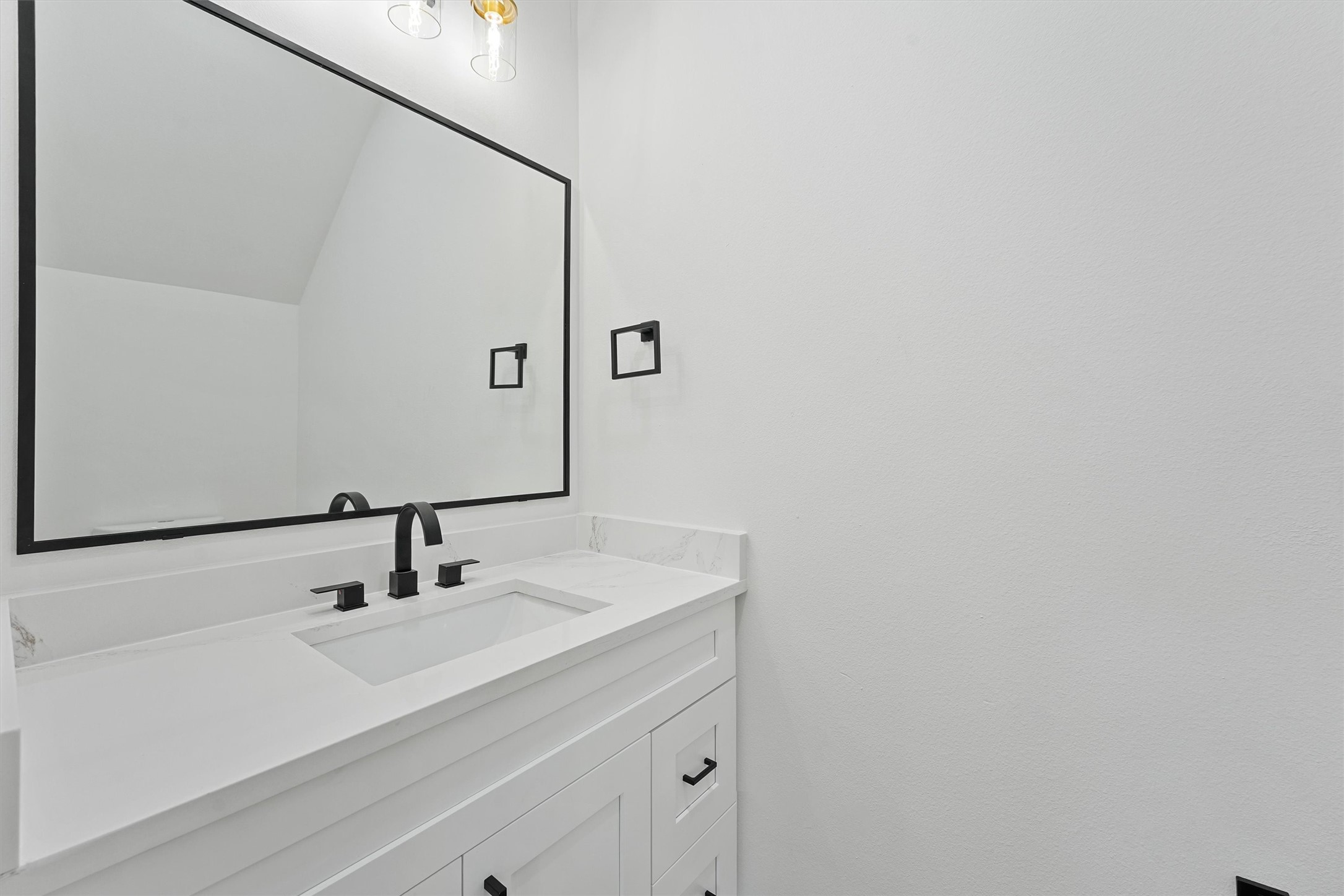 4208 Castor Street, Unit B Houston, TX 77022 - Photo 11 of 23 a bathroom with a sink and a mirror