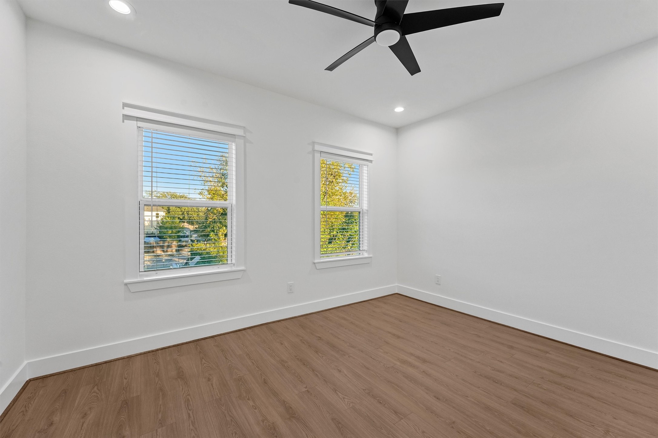 4208 Castor Street, Unit B Houston, TX 77022 - Photo 19 of 23 a view of an empty room with wooden floor and window