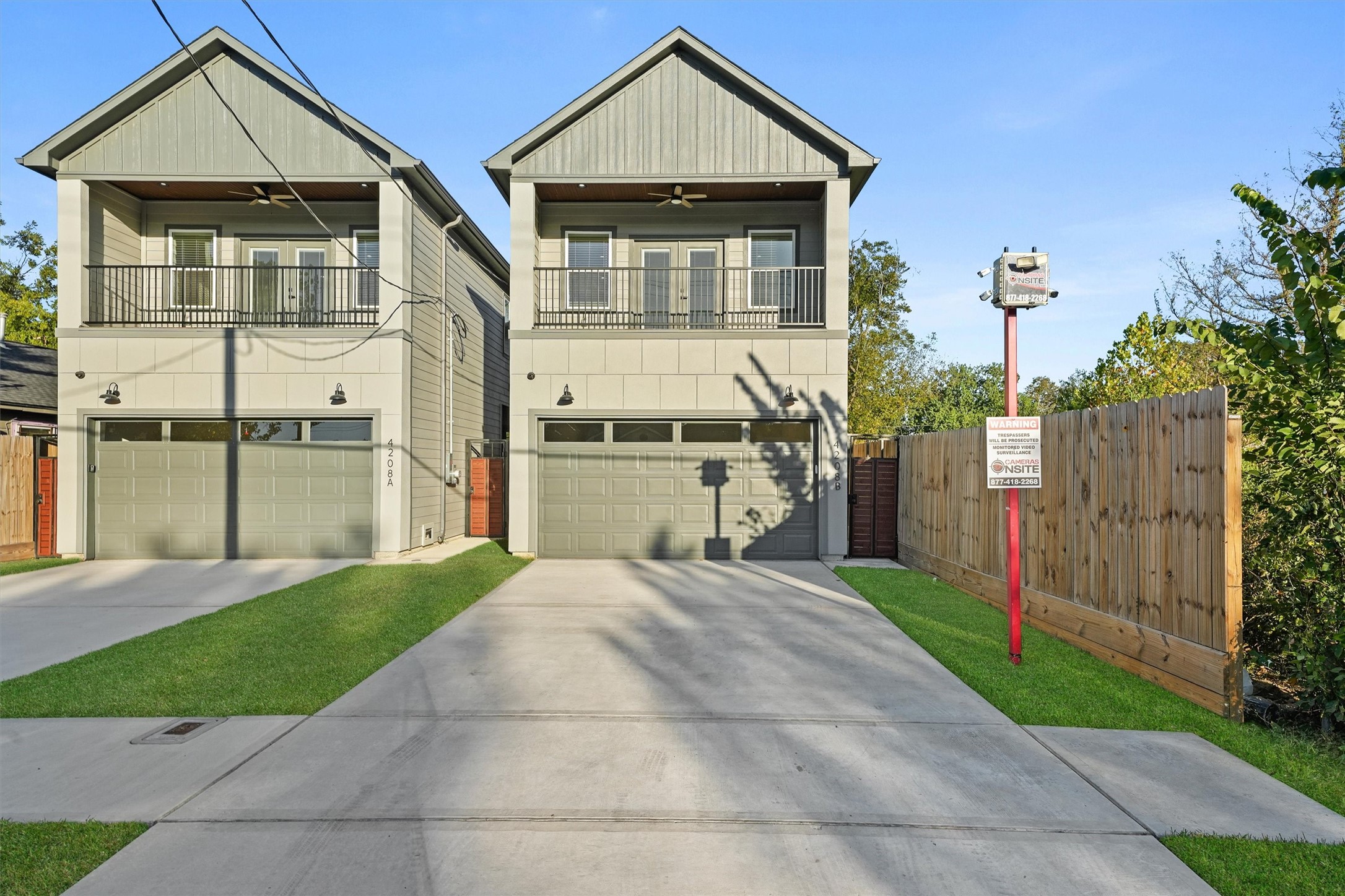 4208 Castor Street, Unit B Houston, TX 77022 - Photo 23 of 23 a front view of a house with a yard and garage
