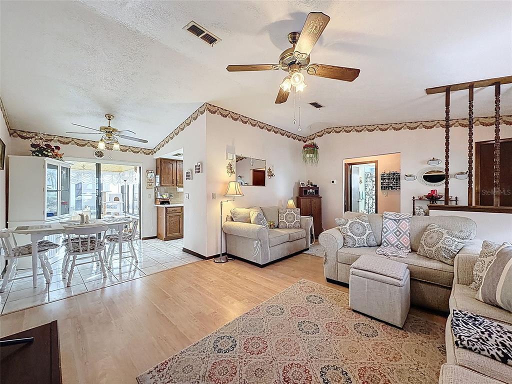 12229 Cedro Street Spring Hill, FL 34609 - Photo 13 of 50 a living room with furniture and white walls