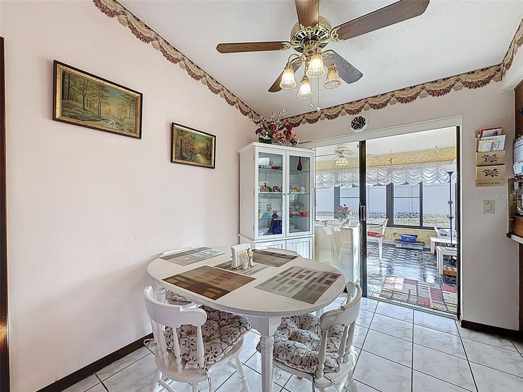 12229 Cedro Street Spring Hill, FL 34609 - Photo 15 of 50 a view of a dining room with furniture