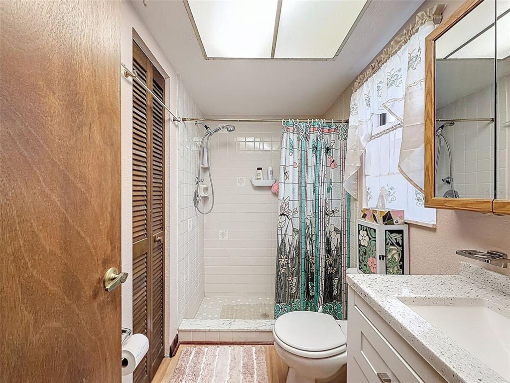 12229 Cedro Street Spring Hill, FL 34609 - Photo 26 of 50 a bathroom with a sink a toilet and shower