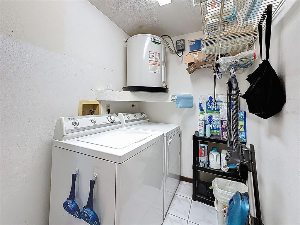 12229 Cedro Street Spring Hill, FL 34609 - Photo 33 of 50 a utility room with dryer and washer