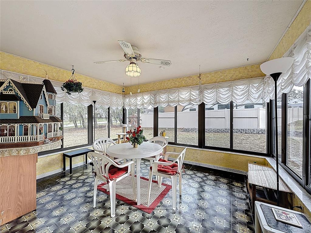 12229 Cedro Street Spring Hill, FL 34609 - Photo 35 of 50 a very nice looking living room with a large window and a rug