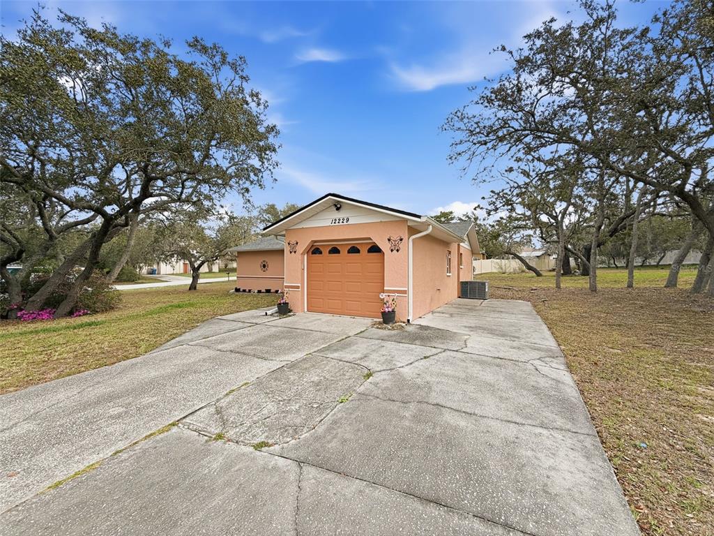 12229 Cedro Street Spring Hill, FL 34609 - Photo 4 of 50 a bathroom with a sink and a yard