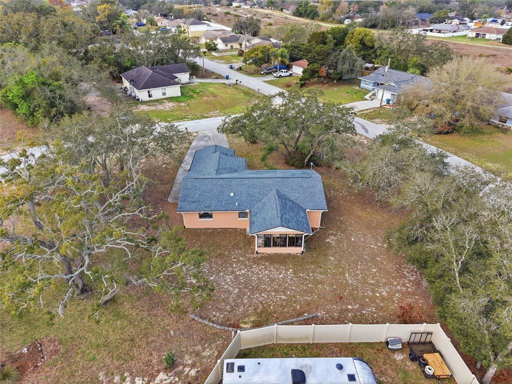 12229 Cedro Street Spring Hill, FL 34609 - Photo 42 of 50 an aerial view of residential houses with outdoor space