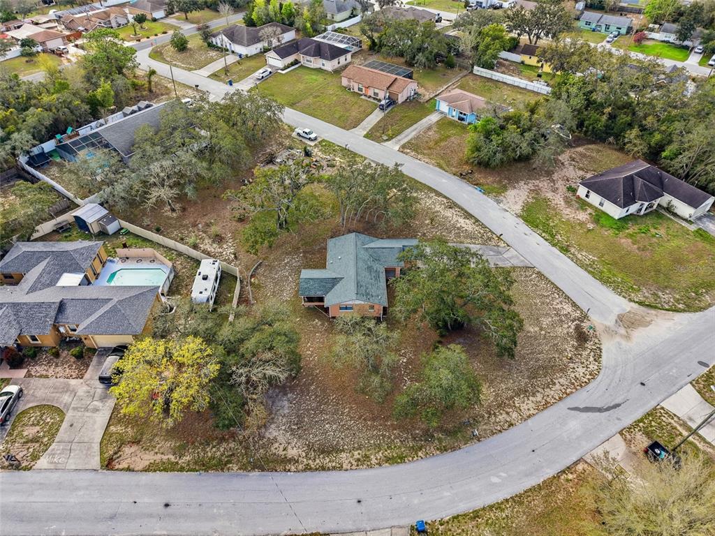 12229 Cedro Street Spring Hill, FL 34609 - Photo 48 of 50 an aerial view of residential houses with outdoor space