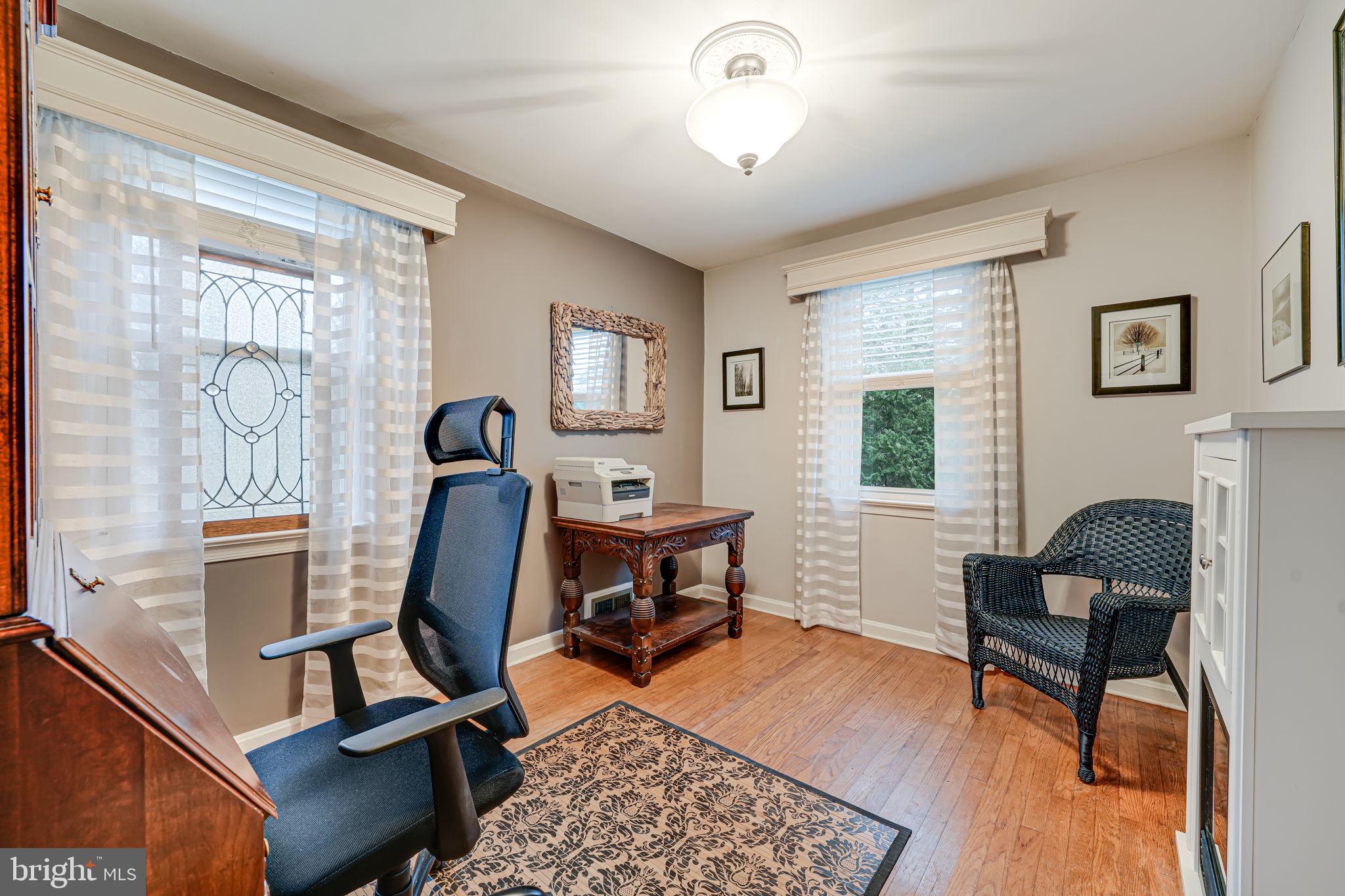 8536 Aponi Road Vienna, VA 22180 - Photo 24 of 40 a living room with furniture and a fireplace