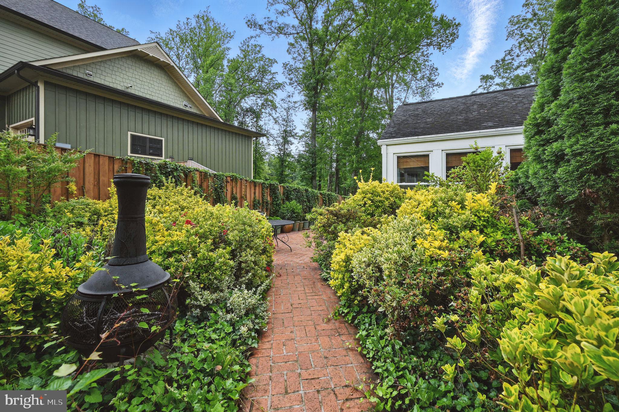 8536 Aponi Road Vienna, VA 22180 - Photo 35 of 40 a view of a pathway with flower plants