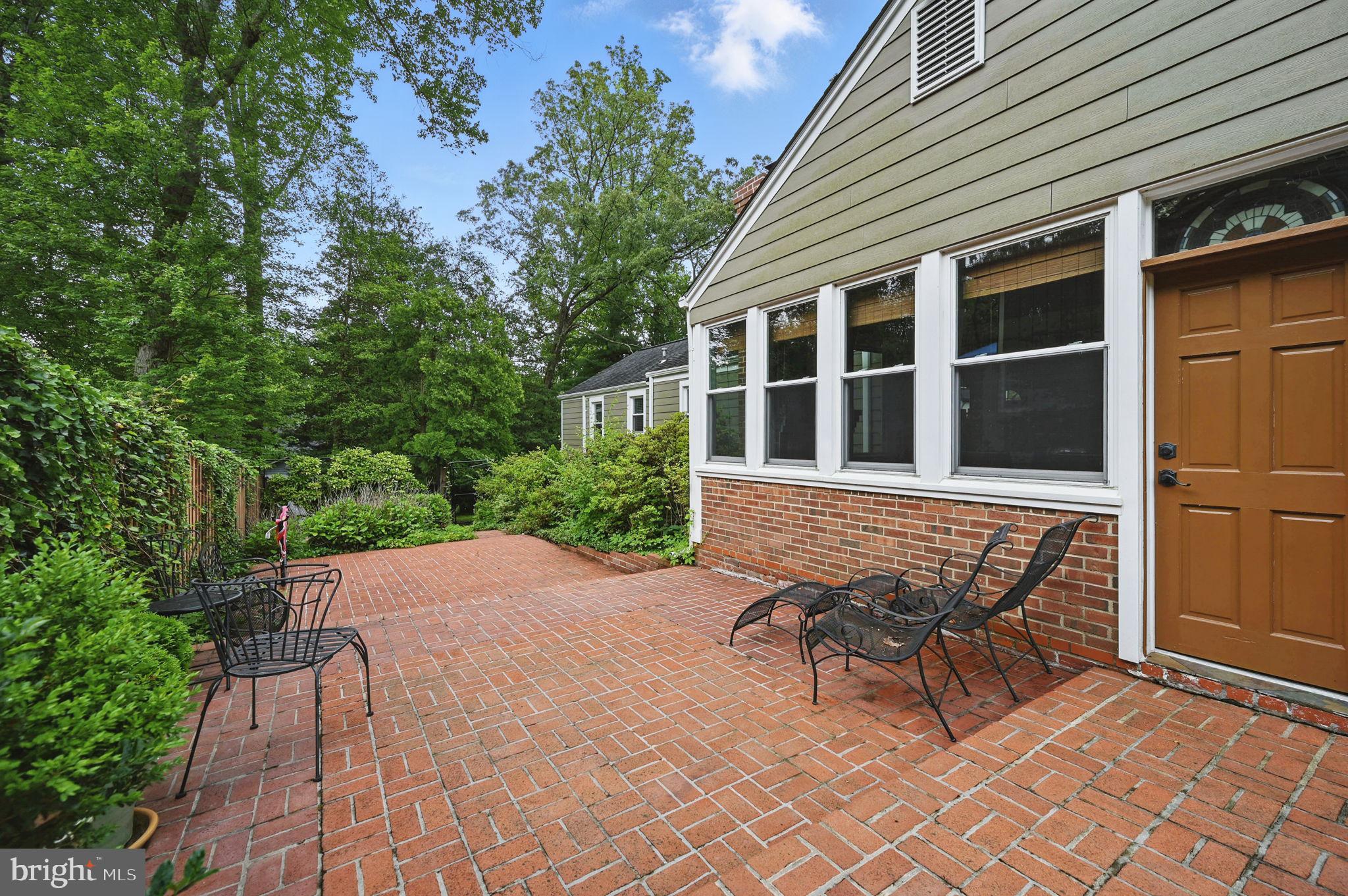 8536 Aponi Road Vienna, VA 22180 - Photo 36 of 40 a bench sitting in front of a house