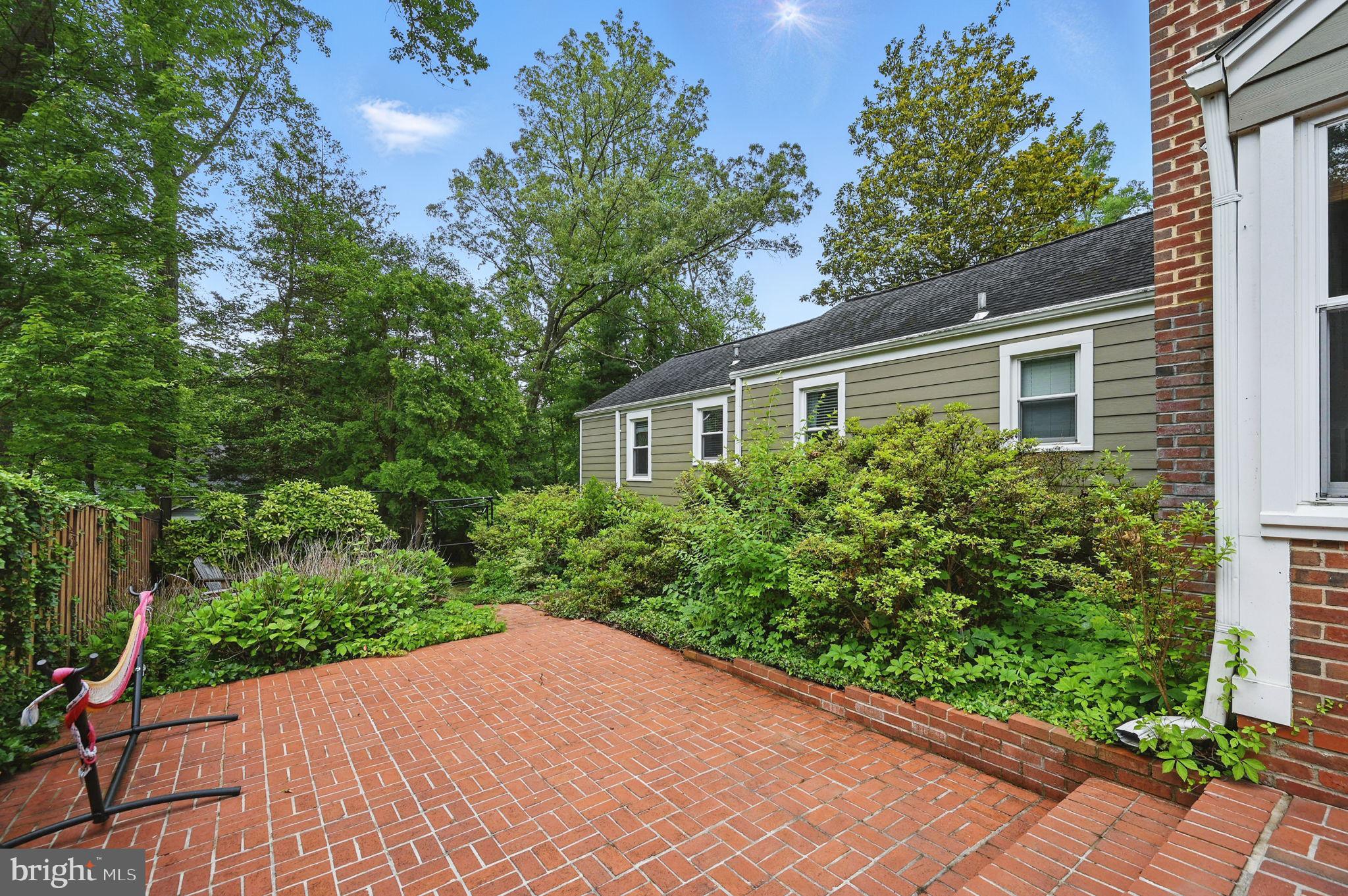 8536 Aponi Road Vienna, VA 22180 - Photo 38 of 40 a view of a backyard with potted plants and large trees
