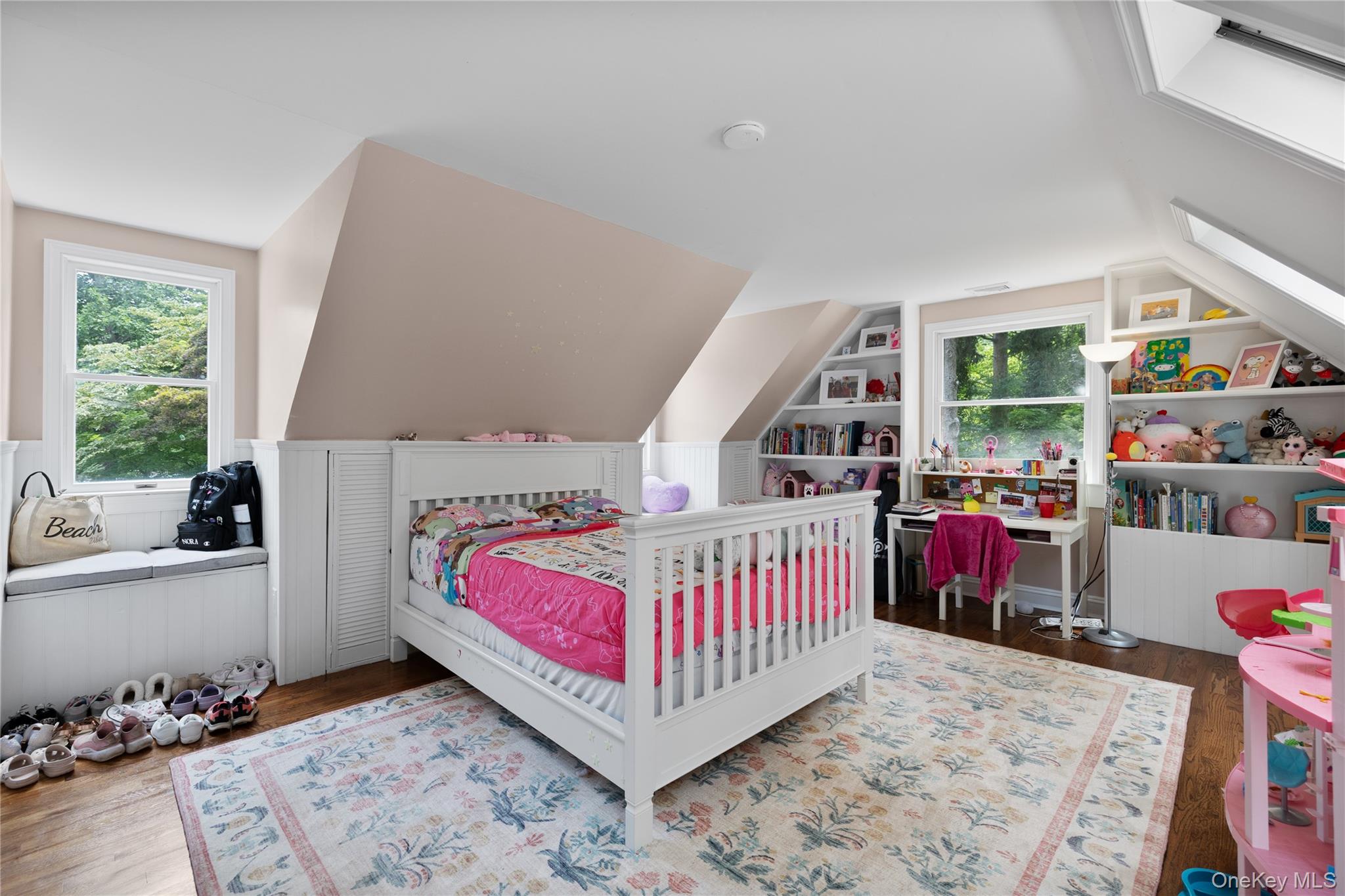 9 Three Sisters Road St. James, NY 11780 - Photo 14 of 36 Attic room featuring hardwood flooring, built-in window seating, and custom built-in shelving