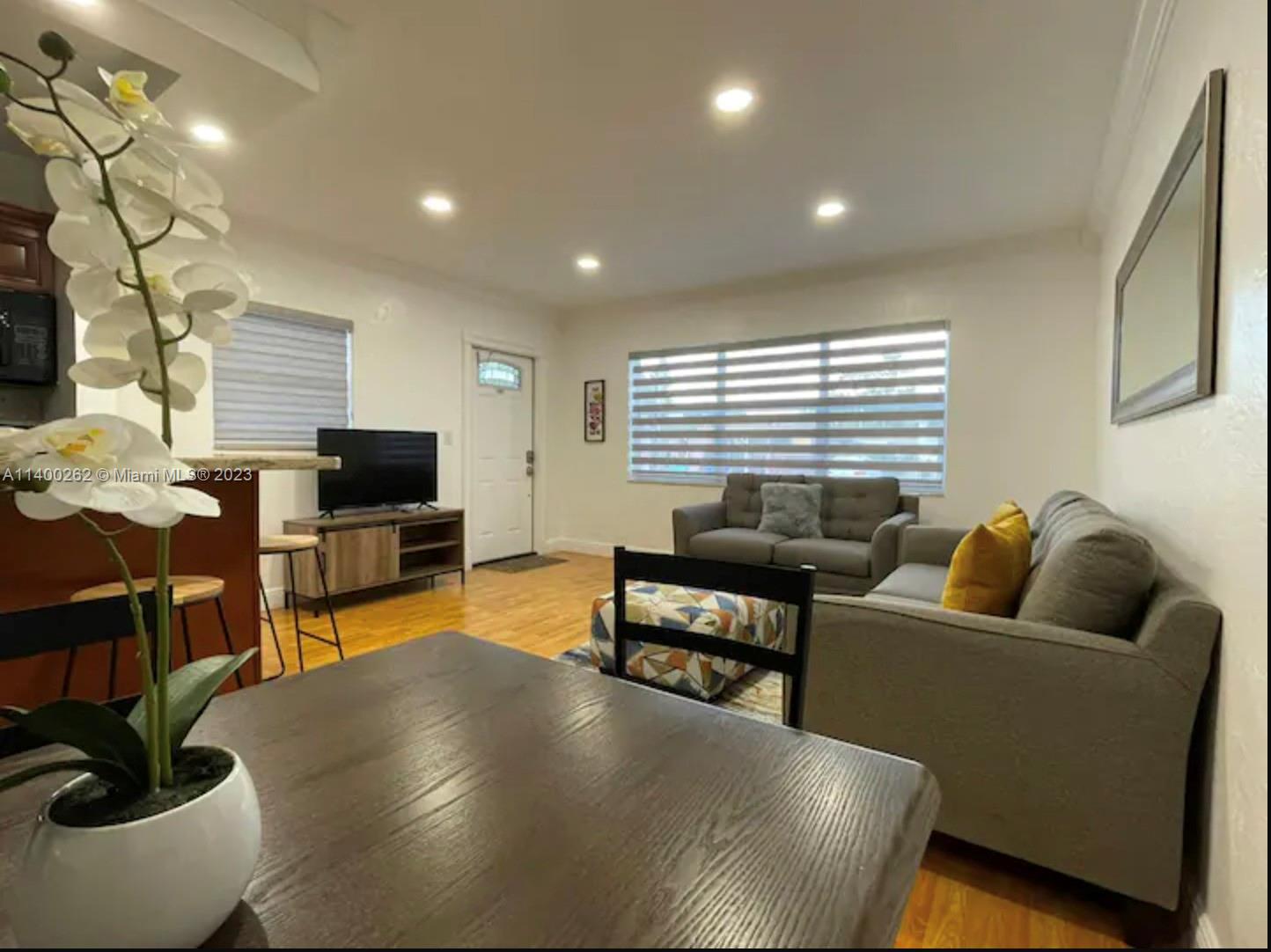 1232 Southwest 30th Place Miami, FL 33135 - Photo 6 of 7 a living room with furniture and a flat screen tv