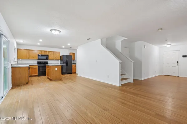 a view of kitchen with wooden floor