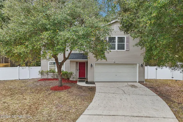 a view of a yard with an outdoor space and seating