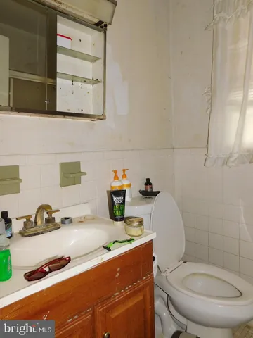 a view of a livingroom with furniture and staircase