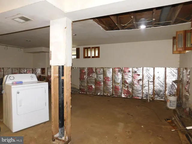 a bathroom with a sink mirror vanity and toilet