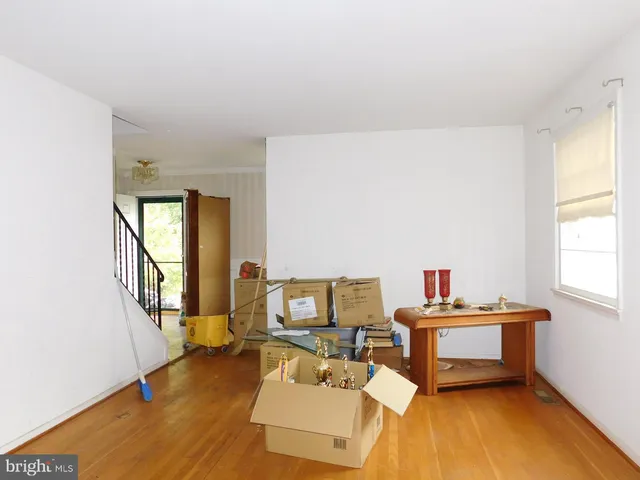 a workspace with furniture and a wooden floor