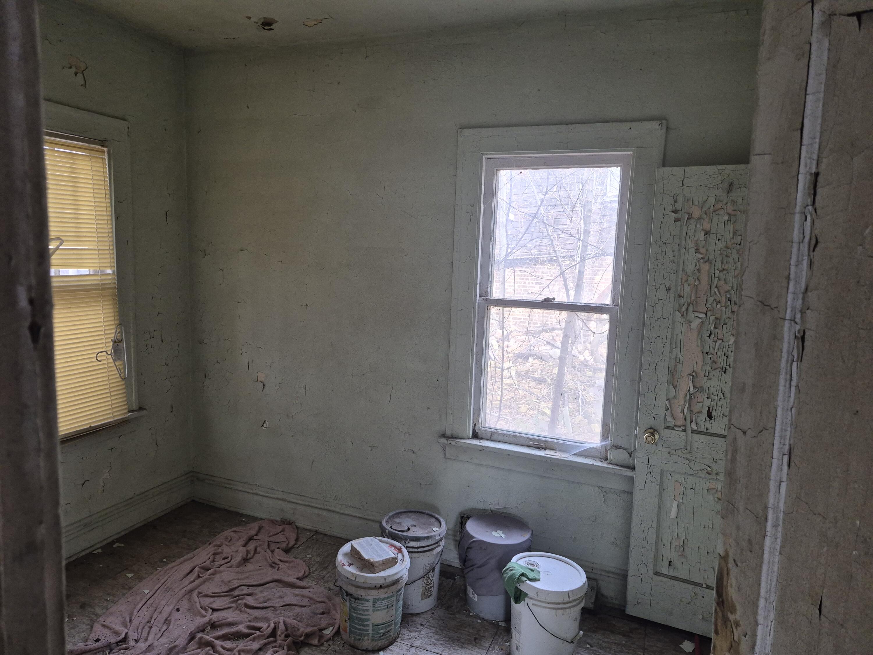 2309 Connecticut Street Gary, IN 46407 - Photo 4 of 4 a bathroom with a toilet window and a shower