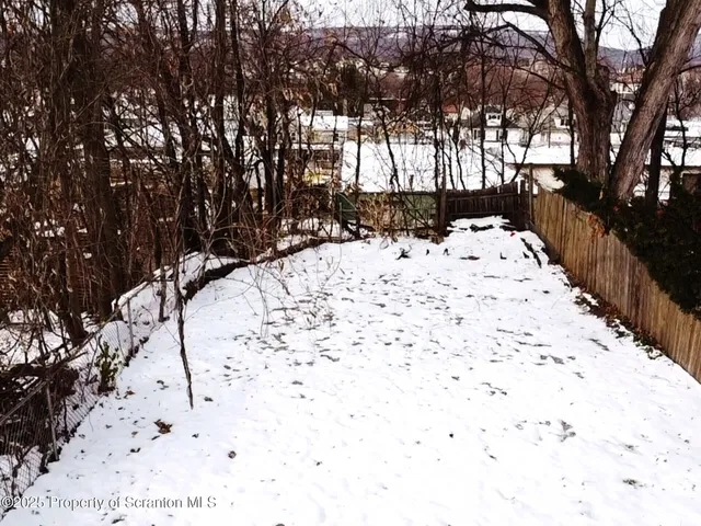 a view of a backyard of the house