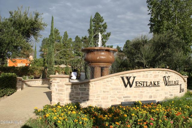 a view of a lake with a yard