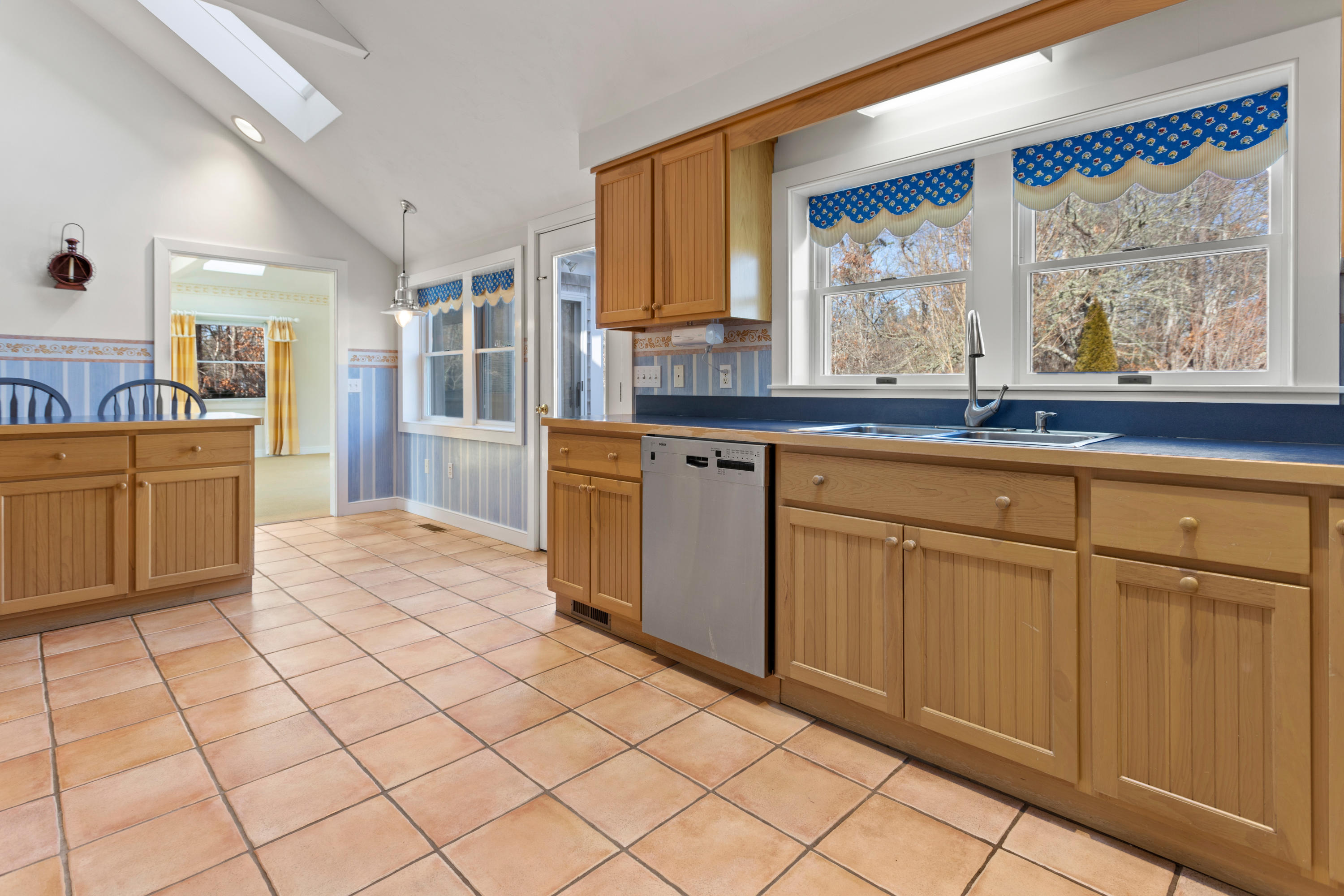 20 Long Road Harwich, MA 02645 - Photo 13 of 40 a kitchen with stainless steel appliances granite countertop a sink and cabinets