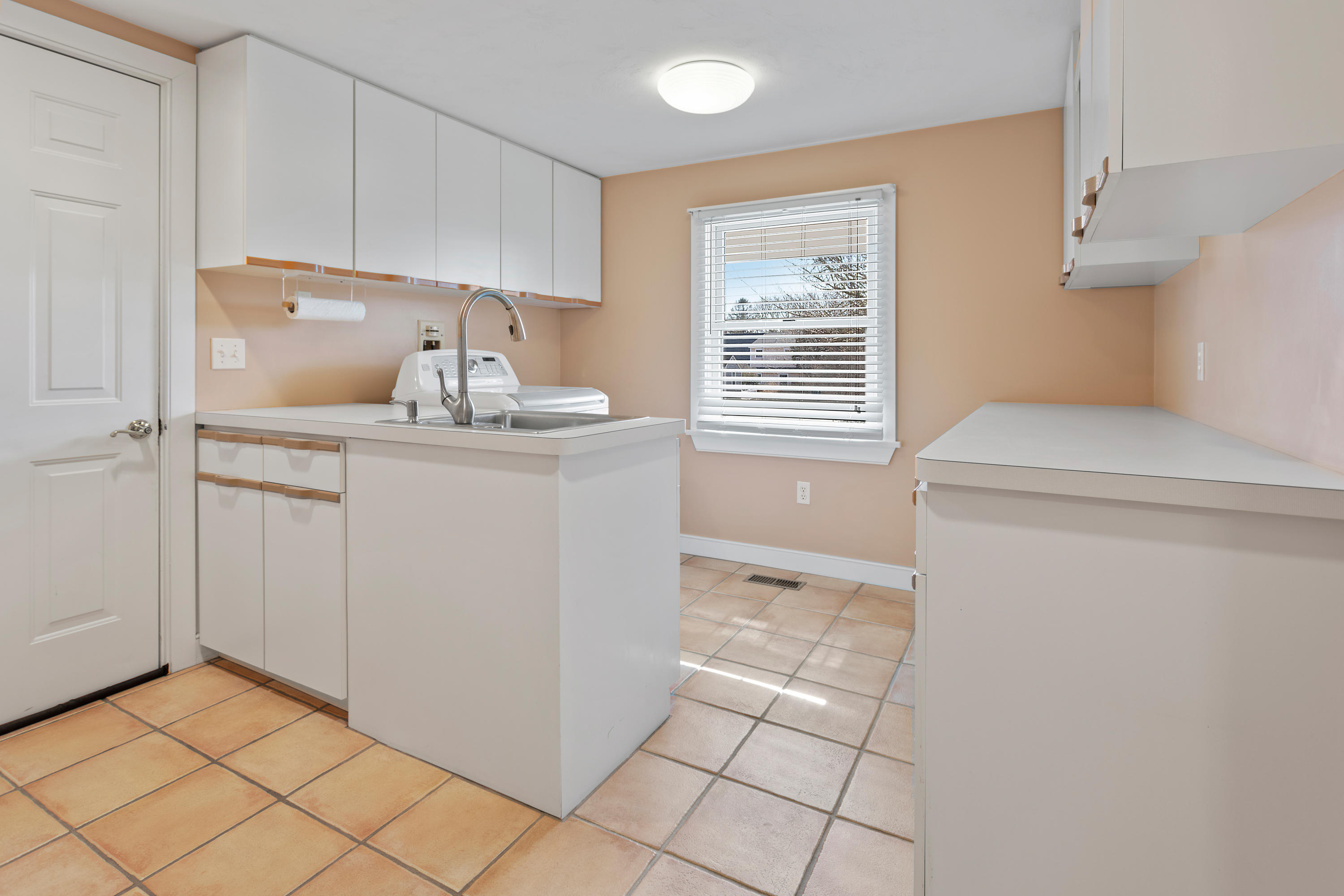 20 Long Road Harwich, MA 02645 - Photo 17 of 40 a utility room with cabinets washer and dryer