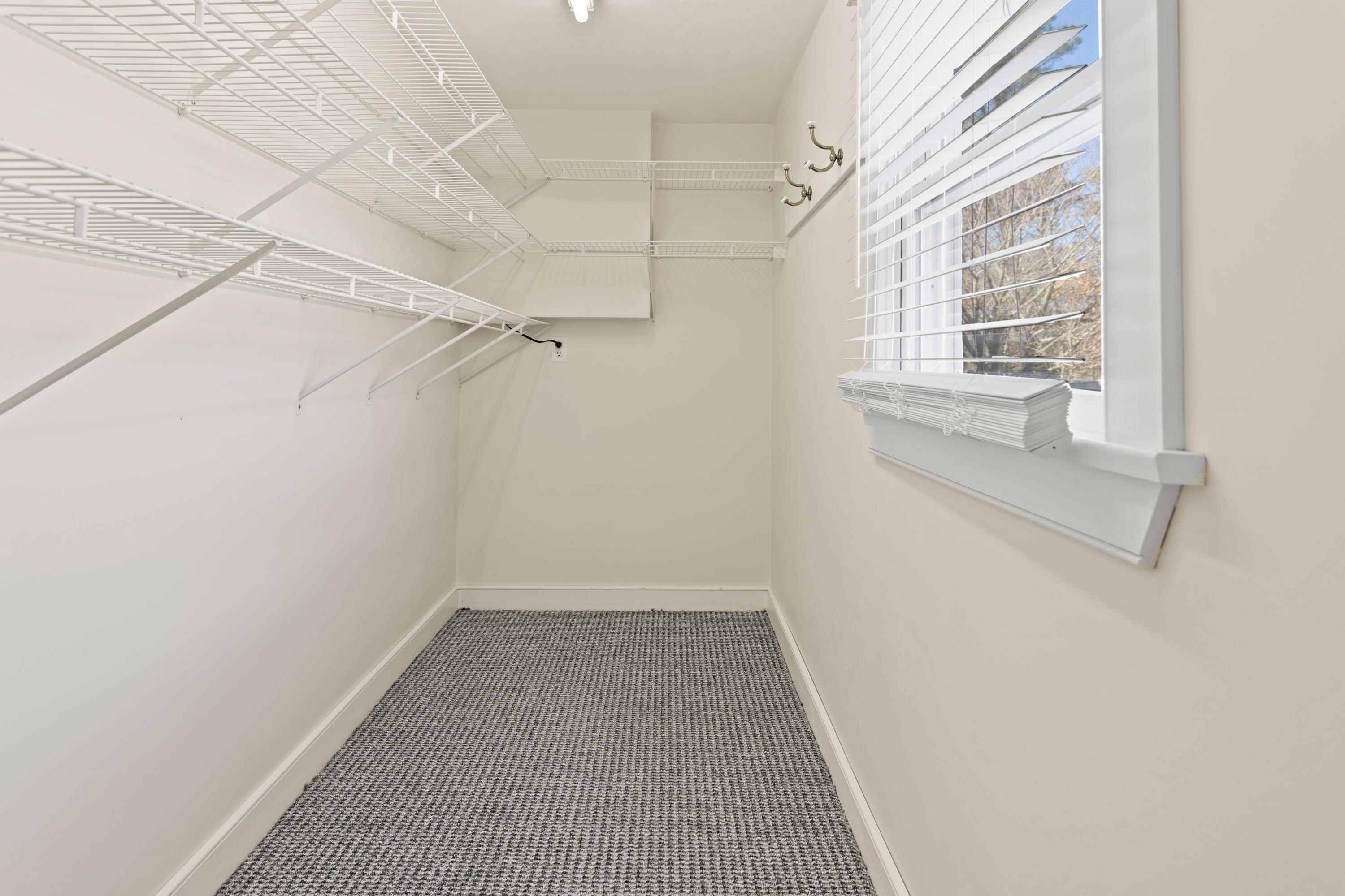 20 Long Road Harwich, MA 02645 - Photo 22 of 40 a view of a hallway with a white walls and a window