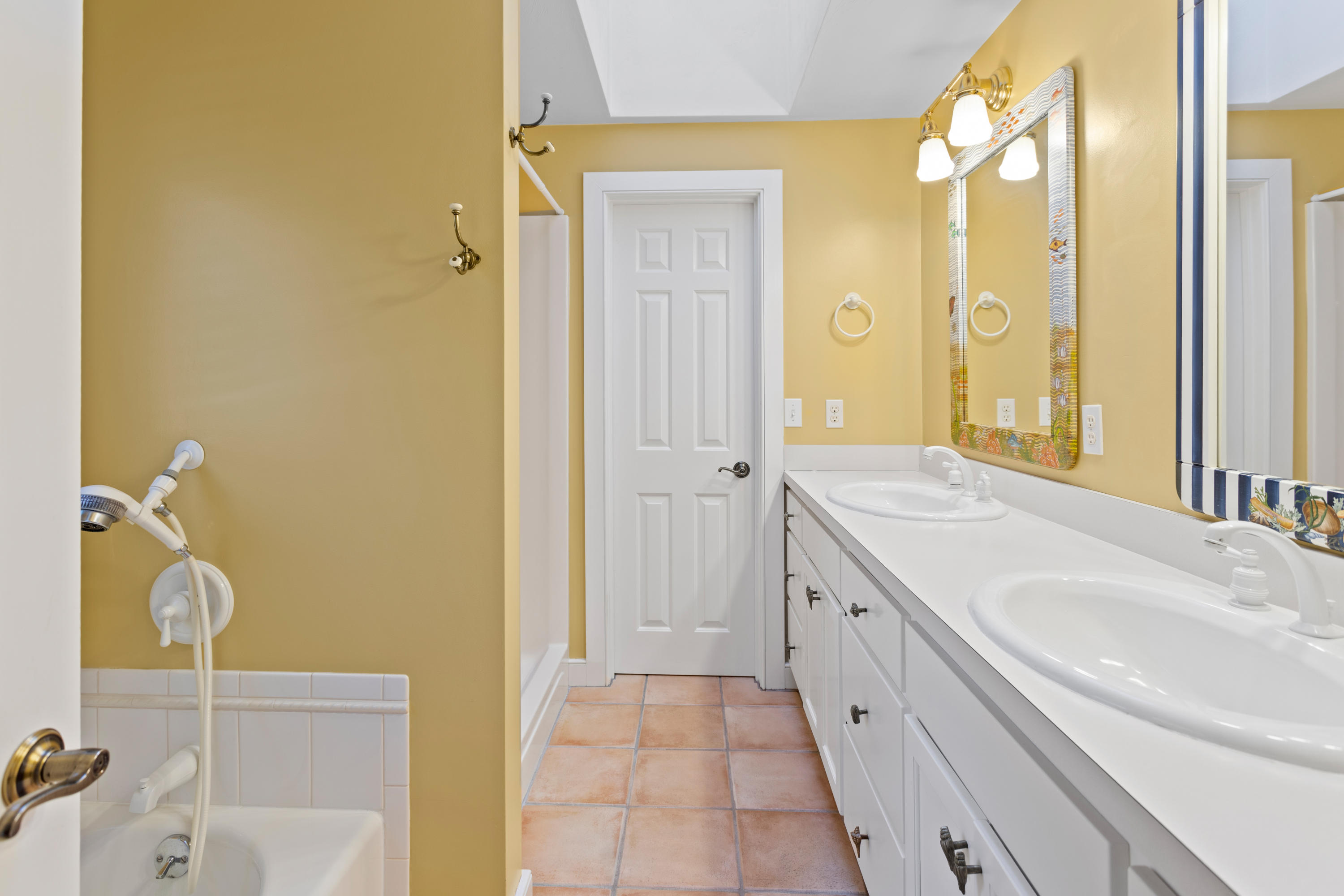 20 Long Road Harwich, MA 02645 - Photo 25 of 40 a spacious bathroom with a granite countertop sink and a mirror