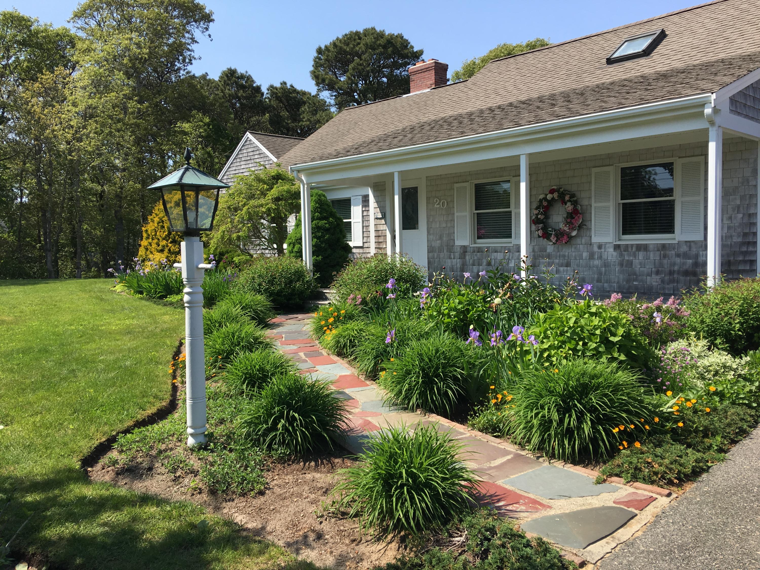 20 Long Road Harwich, MA 02645 - Photo 5 of 40 a front view of a house with garden